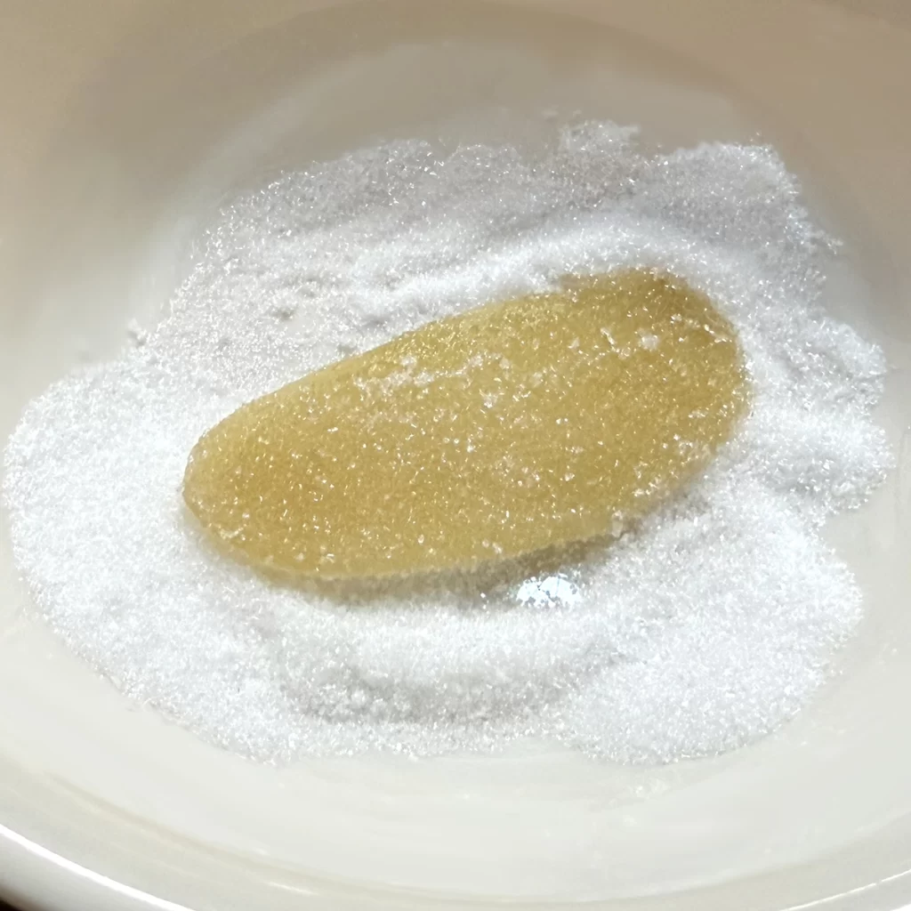 rolling ginger in sugar
